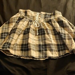 Pleated lace up mini skirt